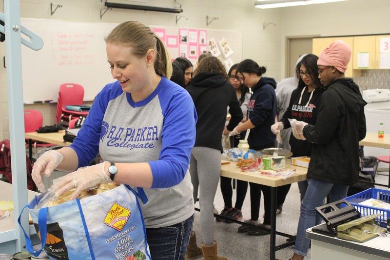 R.D. Parker Collegiate teacher Amanda Stillie packs away some sandwiches April 10 for H3’s new free