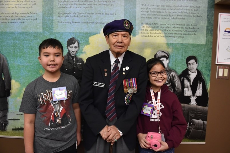 Noah Hutchison (l) and Heaven Garrido learned a lot from veteran Tommy Cheong Wong during a tour of the Chinese Canadian Military Museum.