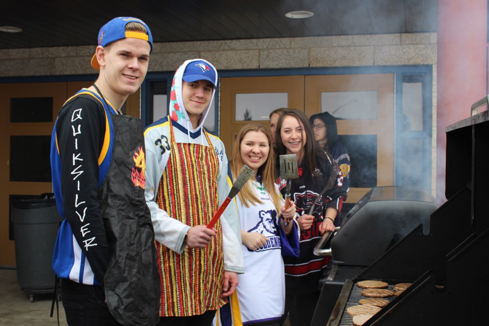 (l-r) Students Dalton Wilson, Caleb Lesnar, Rilynn Enns, and Abby Wiens were among the Virden Collegiate students, staff and Oil Caps players who held a fundraising BBQ for Humboldt. Principal Mark Keown says they raised in excess of $10,000 for the Broncos.