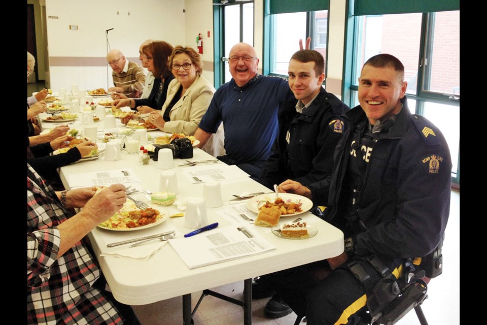 The Southwest Retired Teachers Association invited officers from the Virden detachment to keep order among the rowdy retirees at a recent lunch get-together. No word yet on when Ron Kalinchuk (c) will be released from custody. He was charged with one count of impersonating an eight-year-old.
