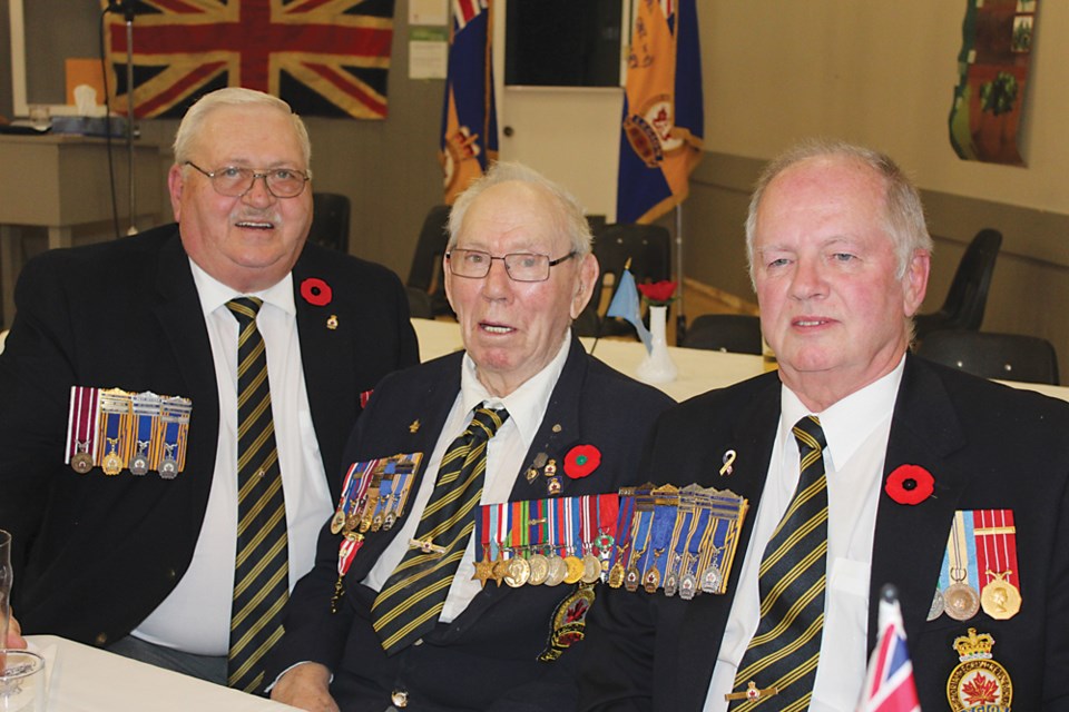 Seated at the 2018 Veterans and First Responders Banquet in Virden Legion Hall, (l-r) Hank Kyle a member of RCL No.8 (Virden), Jack Houston decorated WWII veteran/French National Order Legion of Honour (Kenton) and Mike Ramsden President of RCL No. 118 (Kenton).