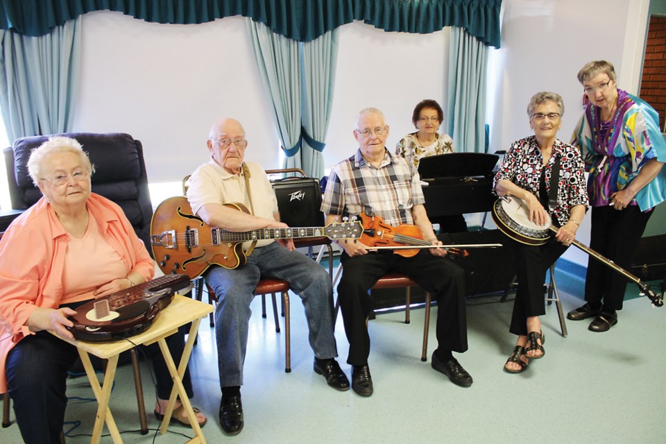 Phyllis Weatherald (Q Chord), Peter Bond (guitar), Corky Clark (violin), Mildred Judd (keys), Margaret Allison (banjo) and Eleanor Williams (rhythm), Friday, May 4 at The Sherwood Personal Care Home.