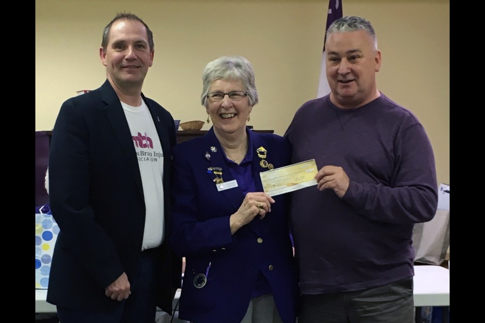 President of Virden Lodge Shirley Gibson (c) presents a cheque to Kevin Tutthill (l) and Dave Sullivan (r) representing MBIA.