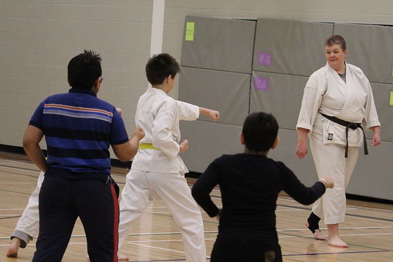 Members of the Thompson Karate Club practise their moves at La Voie du Nord on March 29.