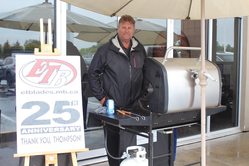 Owner Earl Timmons serves free hotdogs outside the Westwood Mall ET Blades location June 30, his business’s 25th anniversary. Timmons told the Thompson Citizen that he’s been sharpening skates for four decades. Photograph by KYLE DARBYSON.