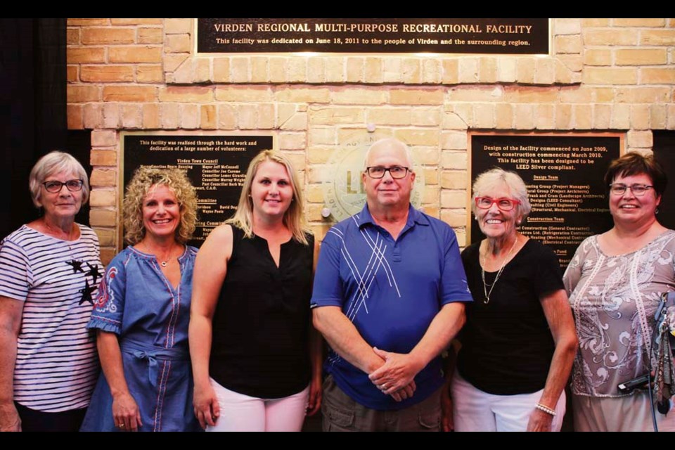 Virden citizens who participated in fundraising that began over eight years ago, for what has become Tundra Oil & Gas Place, standing in front of the newly unveiled plaques; (l-r) Marilyn Warkentin, Joanne Whyte, Jillian Irvin, Ted Jones, Maxine Heritage and Denise Weir.