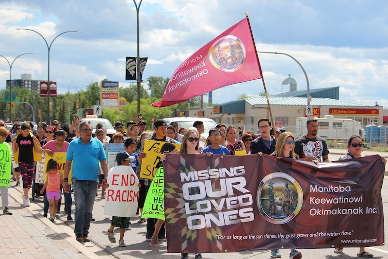 Residents of Thompson and other surrounding communities marched down Mystery Lake Road on Thursday, July 19 to raise awareness for missing family members.