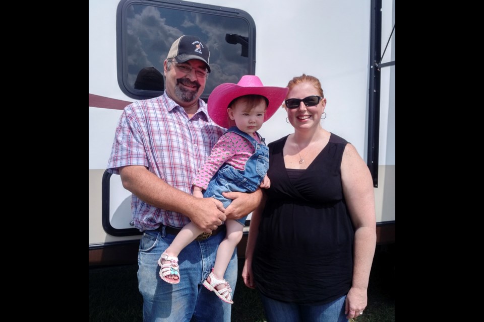 Jack and Crystal Chisholm are on the organizing committee for Virden Draft Horse Show. They are keeping the tradition alive making sure the show goes ahead and providing family enjoyment of horses. "We do it for these guys," says Jack catching up his little daughter.