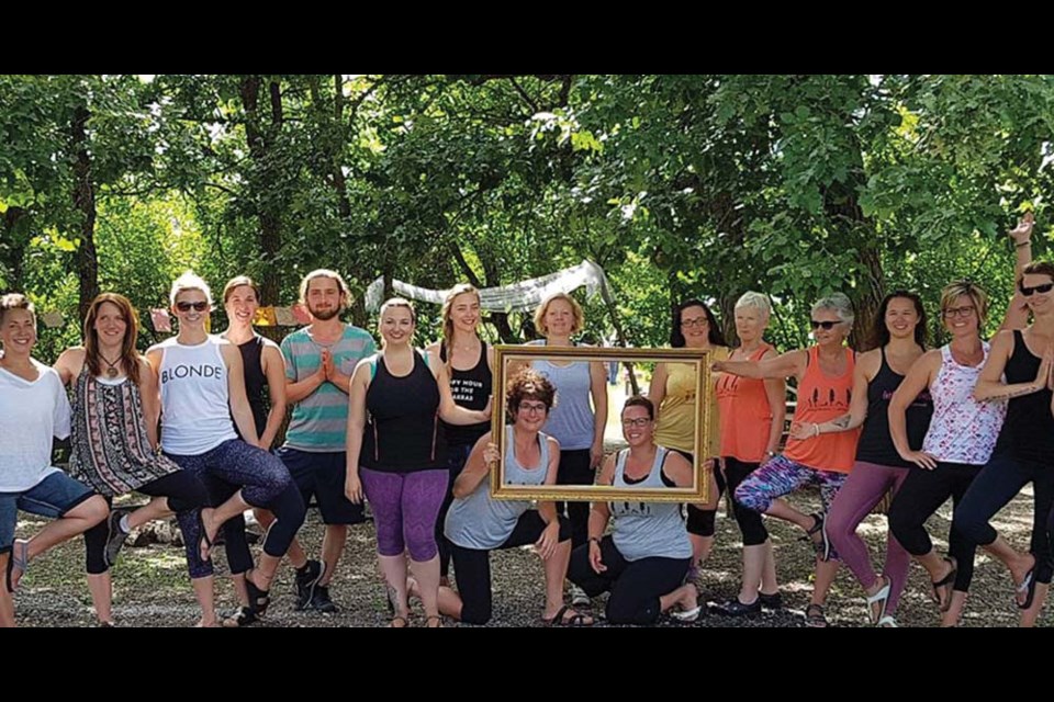 These yoga practitioners represent just a few of the 80 attendees at last weekend’s Follow the Sun Off the Grid Yoga Festival. Organizers Bonnie Michaudville of Hamiota and Laurel Lamb of Virden are framed at centre.