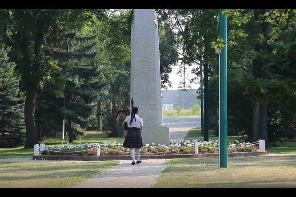 Piper plays to honour the fallen soldiers named on the cenotaph.