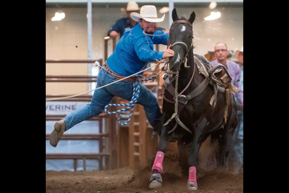 Ory Brown, winner of the High Point award getting down to tie his calf. Entered in two events, team roping and tie-down roping, Brown excelled in the tie-down event and earned enough points to take home the beautiful award saddle.