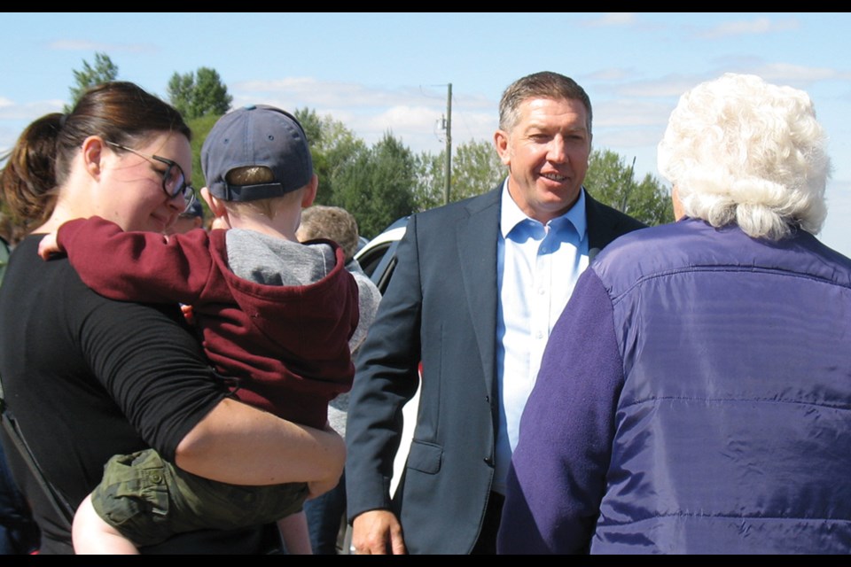 Sheldon Kennedy greets Elkhorn area residents who attended the sign unveiling Sept. 4. The sign recognizes Kennedy’s work to raise awareness and help victims of abuse.