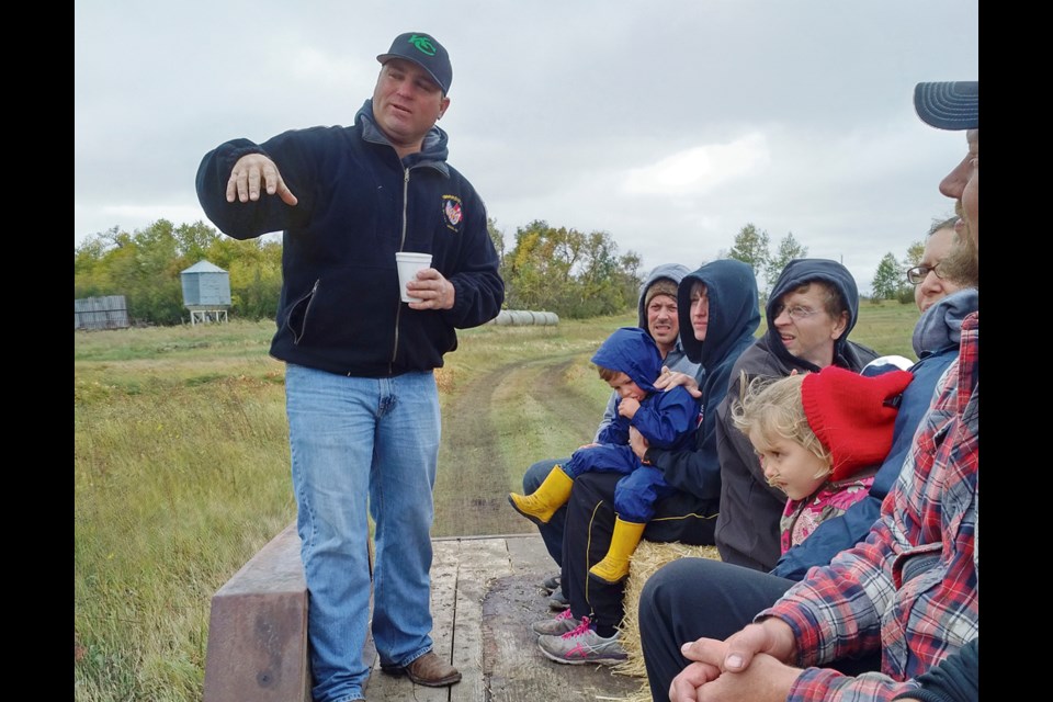 On Open Farm Day, Cam Hodgins guides a tour of Hodgins Farm including bee hives, turkeys, chickens, pigs, sheep and cattle, explaining the hows and whys of his naturally grown produce.