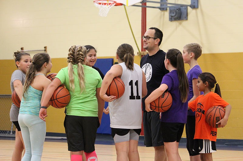 Prairie Elite Basketball Academy co-founder JP Beauchemin walks a group of Grade 5−6 students throug