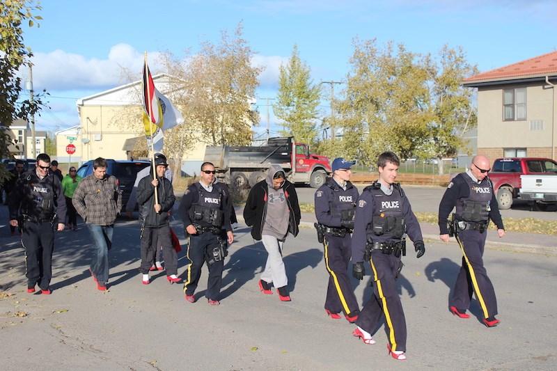 Members of the Thompson RCMP sported some unorthodox footwear during Wednesday’s Walk a Mile in Her Shoes event.