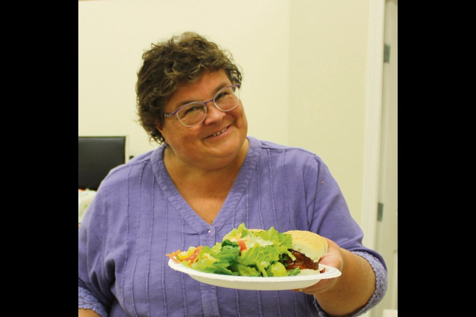 Quilting instructor Karen Bialik from Lethbridge, Alta. enjoys lunch with fellow quilters, Thursday, Oct. 4, in the Lions Hall. Margaret James provided the tasty lunch, with proceeds donated to the pet rescue Virden Pet Network.