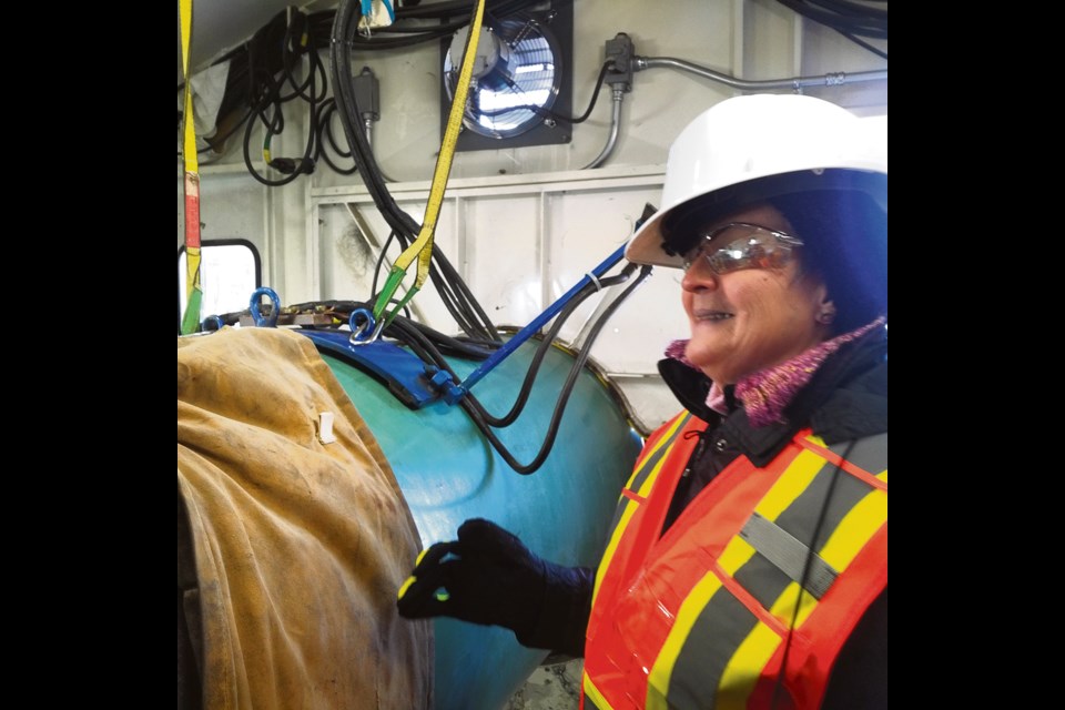 Outfitted in safety gear, RM of Sifton resident Pat Cochrane observes the process within the welding shack, Oct. 12 on the Enbridge Line 3 Replacement tour.