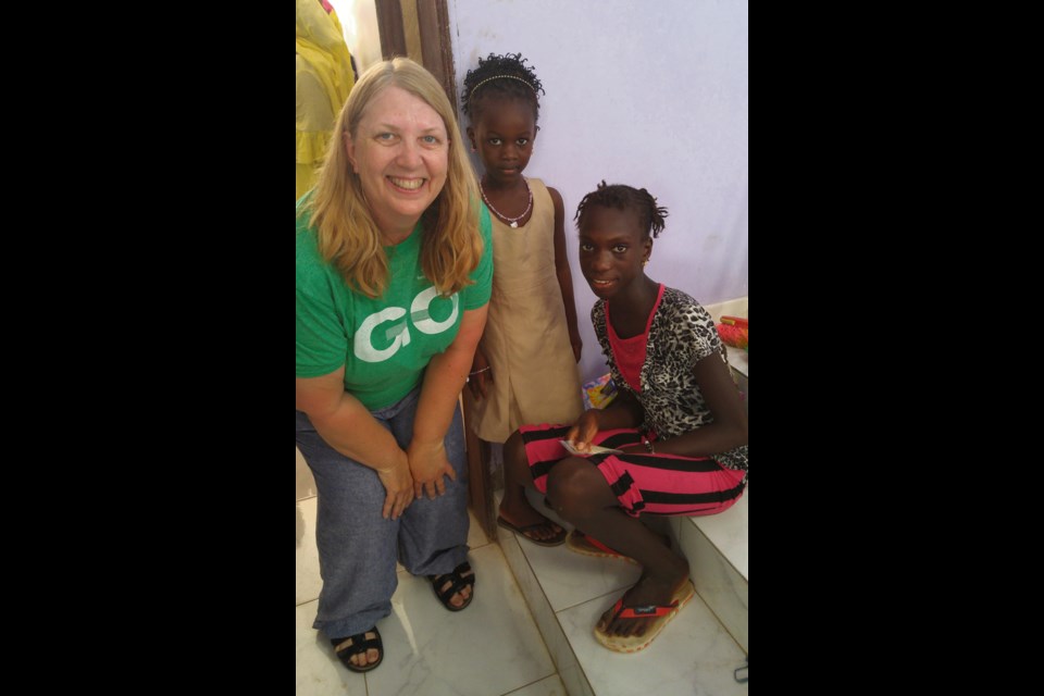 Susan Nelson of Virden has just given these girls in Dakar, Senegal the Christmas Child shoe box that she brought from Canada. It's a thrilling moment for her.