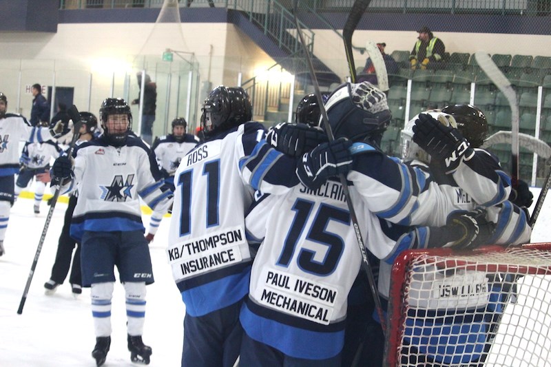 The Norman Northstars celebrate their first home win of the season after beating the Kenora Thistles at the C.A. Nesbitt Arena by a final score of 4−3.