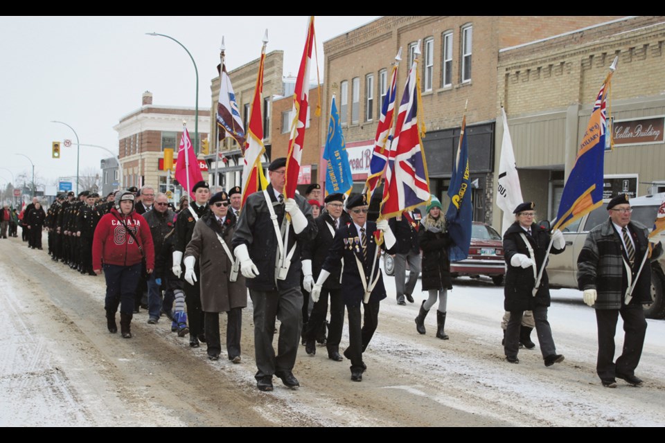 Led by the drone of Scottish bag pipes, members of RCL Br. No. 8, C Battery of the First Royal Canadian Horse Artillery from CFB Shilo, members of Virden Lions Club, Scouts and Guides, RCMP, and Wallace District Fire Department marched down gritty streets. Despite a cold, thin wind on a minus degree morning, the parade marched the route along Eighth Ave., down Nelson St., along Seventh Ave. and back up Wellington St. to the Aud Theatre on Sunday morning, Nov. 11.