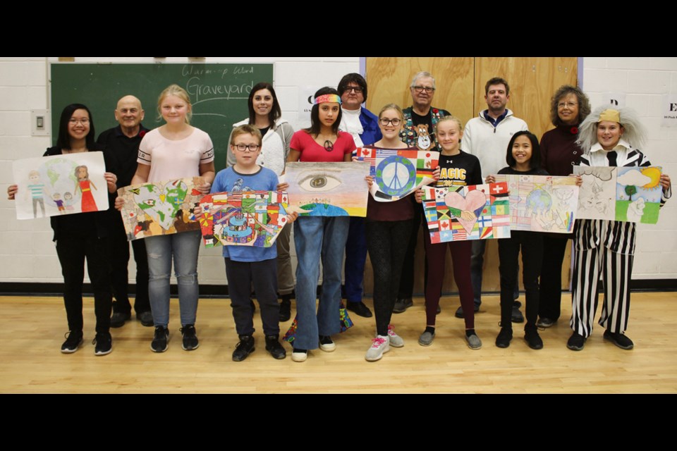 Winners of the Lions International Peace Poster Contest are presented with certificates. Placings of first to fourth are receiving cash awards with first place receiving $50 at Virden Junior High School Assembly, Oct. 31; (rear l-r) Lion President Murray Hagyard, teacher Jason Routledge, teacher H. Cantelo, facilitator Joan Veselovsky, Lion Ben Veselovsky, VJH Principal Don Nahachewsky. Students (l-r): 1st - Finn Abel; 2nd - Fiona M. Garcia; 3rd - Peyton Stuart; tied for 4th place Skylar Andries and Josie Hunter. Honourable mentions: Ethan Mead, Holly Lane and Amy Wu. In total the Lions awarded $160. The contest encourages children ages 11-13 to creatively express what peace means to them. The theme for the 2018-19 contest is Kindness Matters.
