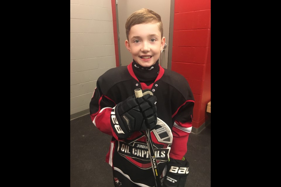 Fifth Grader Seth Eady created winning design for new Oil Caps jersey.