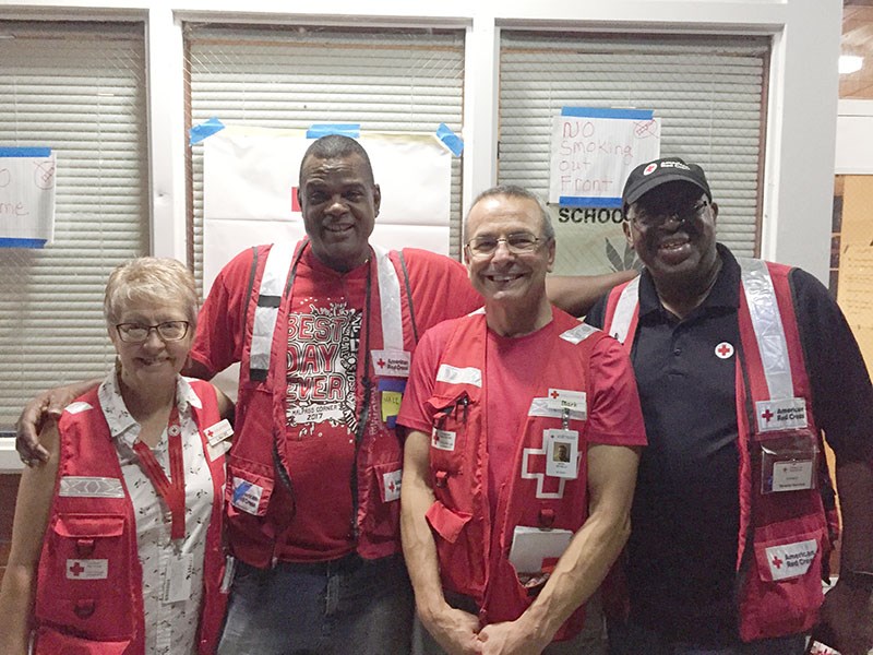 Outside the Burgaw, North Carolina Red Cross shelter. Canadian volunteers Louise Hodder and Mark Szyszlo of Thompson with American Red Cross volunteers Mark Jones and Ed Harris.