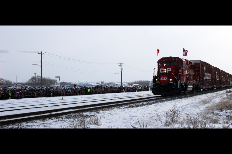 At exactly 10:30 a.m. the Holiday Train arrived in Virden from points east. The crowd waiting to meet it was, arguably, one of the largest ever.