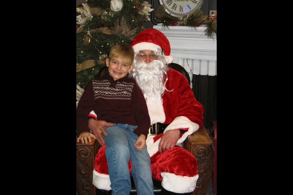 Sawyer Tutthill of Elkhorn is in early to see Santa. Photos with Santa, the first of many events and activities held at the annual Light-up event in Elkhorn.
