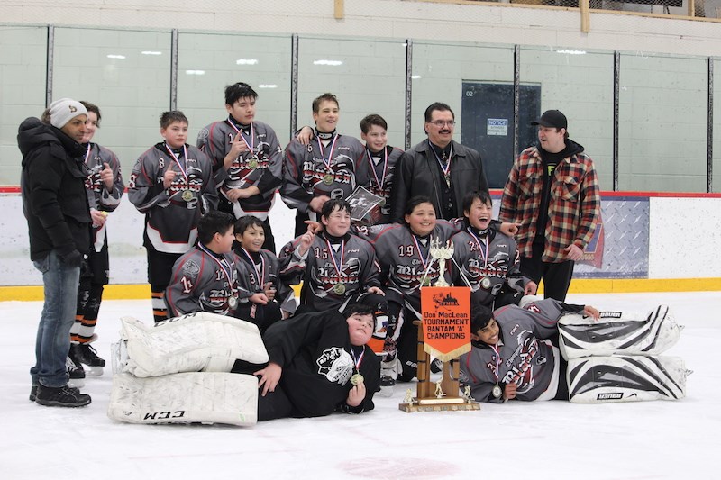 The Thompson Blades and Flin Flon Bombers celebrate their status as bantam A and AA champions at the tail end of the 27th Don MacLean Memorial Tournament.