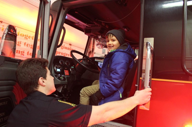 Carson Stoltz gets behind the wheel of a fire truck during his brief stint as the head of Thompson Fire & Emergency Services Dec. 19.