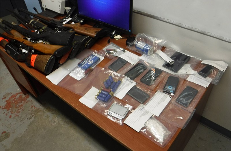 Thompson RCMP seized 32 grams of cocaine and nine unsecured guns while executing a search warrant at a Sp]lit Lake residence Jan. 11. Two people are facing charges.