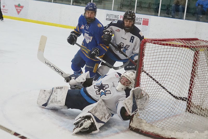Norman Northstars goaltender Rylan Potkonjak scrambles to defend the net during the second period of