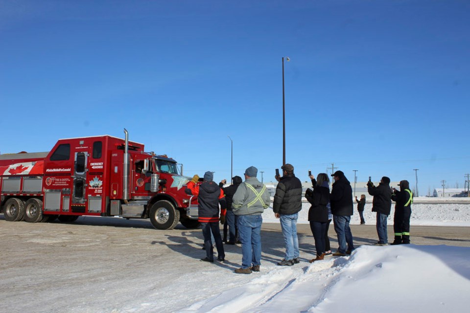 Local supporters welcome the lead rig of the United We Roll convoy as it makes a lunch stop on the Virden frontage road.