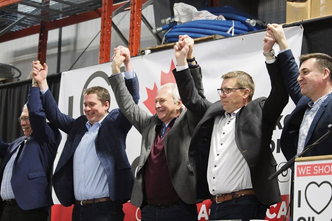 At the Moosomin Pro-Resource Rally, Saturday, Feb. 16. (l-r) MP Larry Maguire, Conservative Leader Andrew Scheer, Premier of New Brunswick Blaine Higgs, Sask. Premier Scott Moe and MLA Steven Bonk before a cheering crowd at the close of the rally.