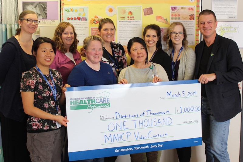 Manitoba Association of Health Care Professionals president Bob Moroz (far right) presents Thompson dietitians with a cheque for $1,000 on March 5.