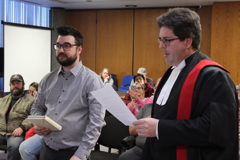 Provincial court Judge Todd Rambow swore in March 11 byelection winner Andre Proulx during the March 18 Thompson city council meeting.