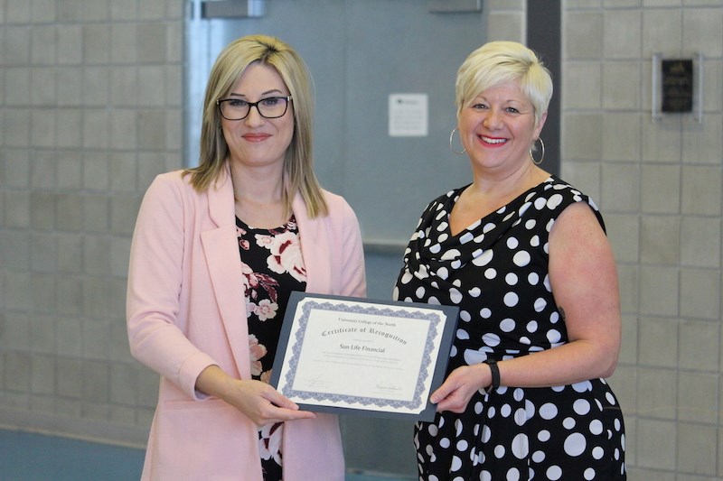 University College of the North co-op education coordinator Krystle Paskaruk (left) handed out awards to over a dozen local businesses and organizations like Sun Life Financial, the School District of Mystery Lake and Burntwood Custom Builders during a March 18 luncheon at the Thompson Regional Community Centre.