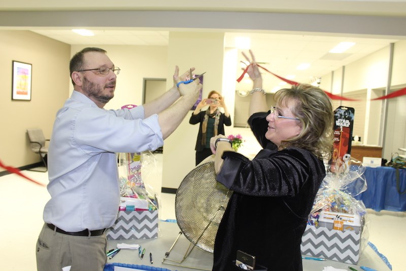 Acting Manitoba ombudsman Marc Cormier and head Manitoba advocate for child and youth Daphne Penrose celebrate the grand opening of their shared office in Thompson with a ribbon-cutting ceremony April 16.