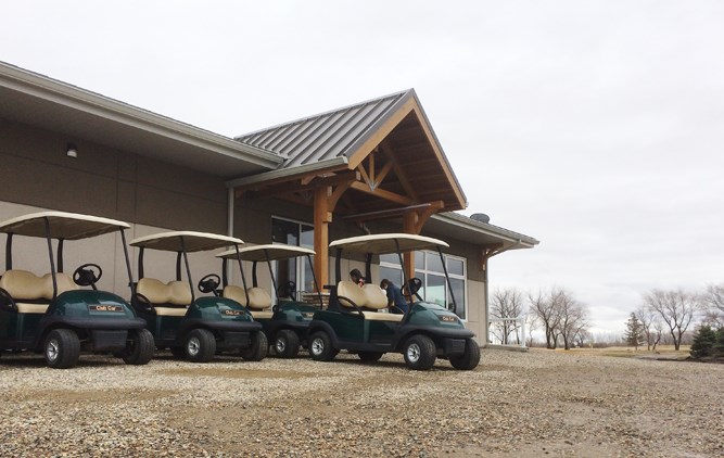 Golf carts are lined up and ready to go. The course opens this weekend.