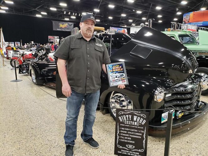 Dwayne Wiltshire with the First Place Truck and the Outstanding Truck awards for his custom build at World of Wheels in the Winnipeg RBC Convention Centre.