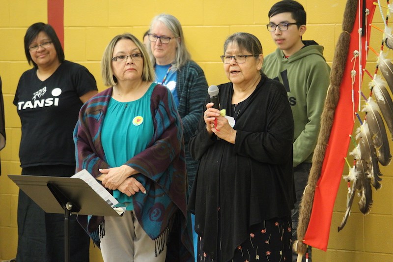 Grade 5 teacher Margaret Dumas and elder Vicky Young kick-off the May 15 Cree Language Festival inside the Wapanohk Community School gymnasium.