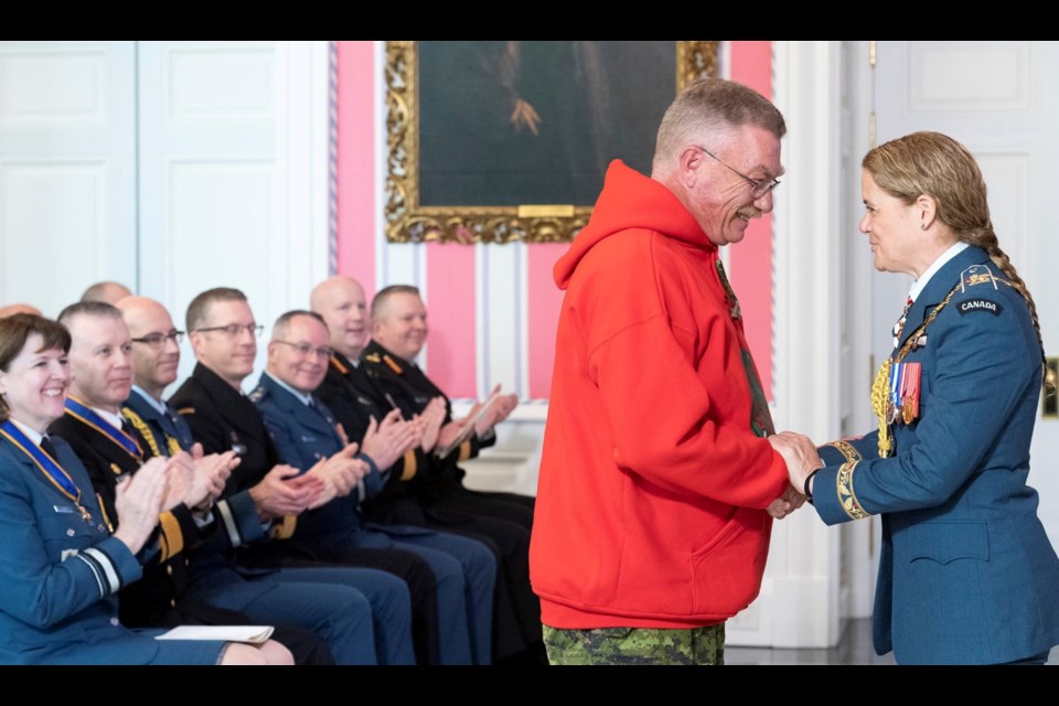 Snow Lake Canadian Rangers Patrol Commander Sgt. Ron Scott receiving his award from Gov. Gen. Julie Payette.