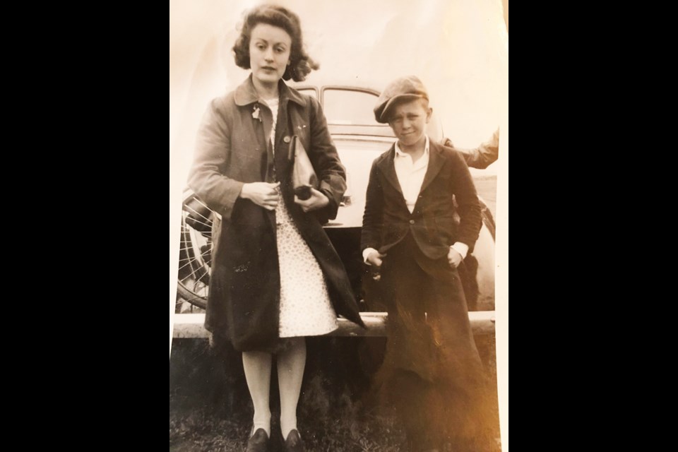 Taken in 1934 at Butler, Man., young school teacher Violet Leslie with her 10-year-old student Len Downer.