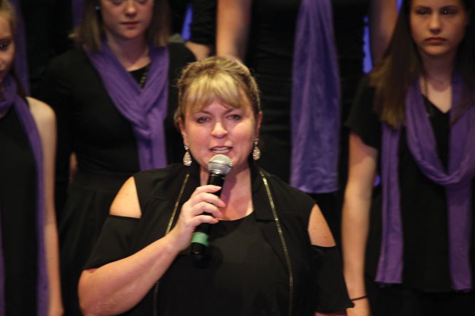 VCI Choir Director and educator Michelle Chyzyk introduces the evening's presentations in Virden Aud Theatre, June 11.