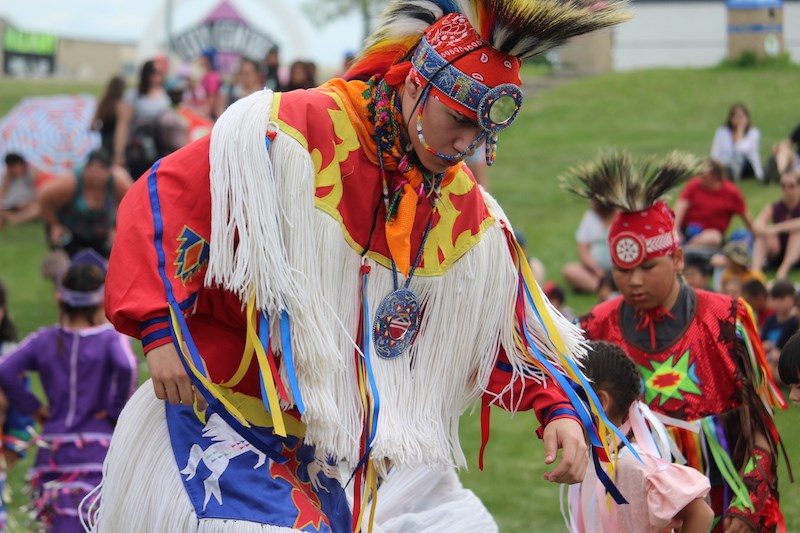 A group of traditional dancers performs at MacLean Park for National Indigenous Peoples Day.