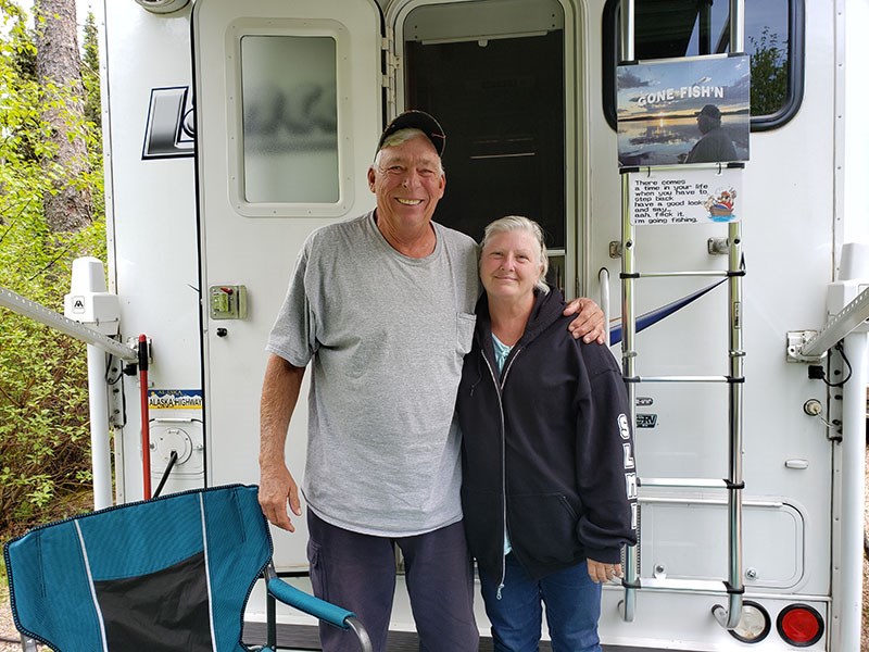Russ “Rooster” and Nancy Wester in back of their camper at their lot at Wekusko Falls campground.
