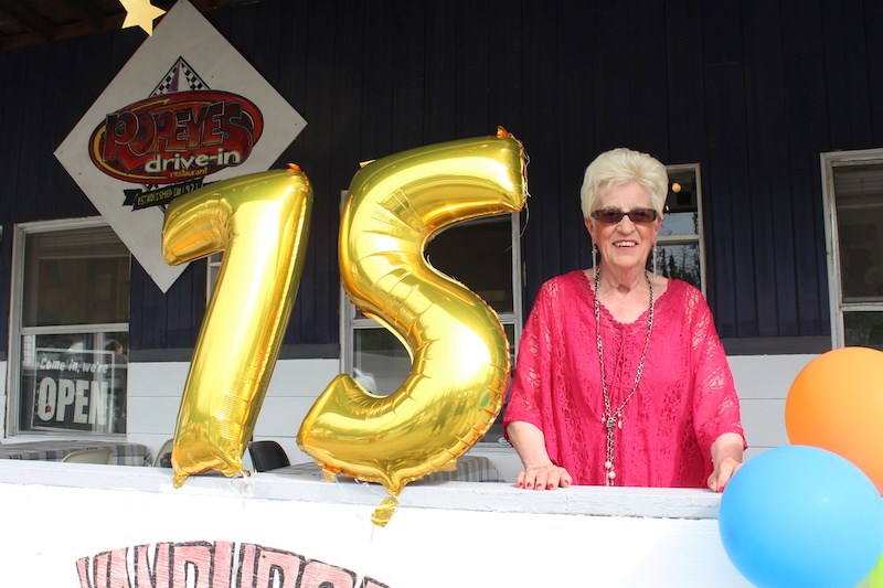 Alice Lavoie poses for a photo during her July 7 birthday celebration at Popeye’s, a business she’s run in Thompson for 48 years.