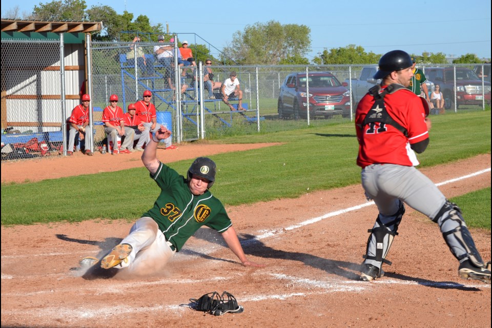 Jeff Peel was on fire Monday night both on the mound and sliding into home as the Virden Oilers showed Hamiota the door out of the playoffs, beating them 11-5 in Game Two of the three-game series.