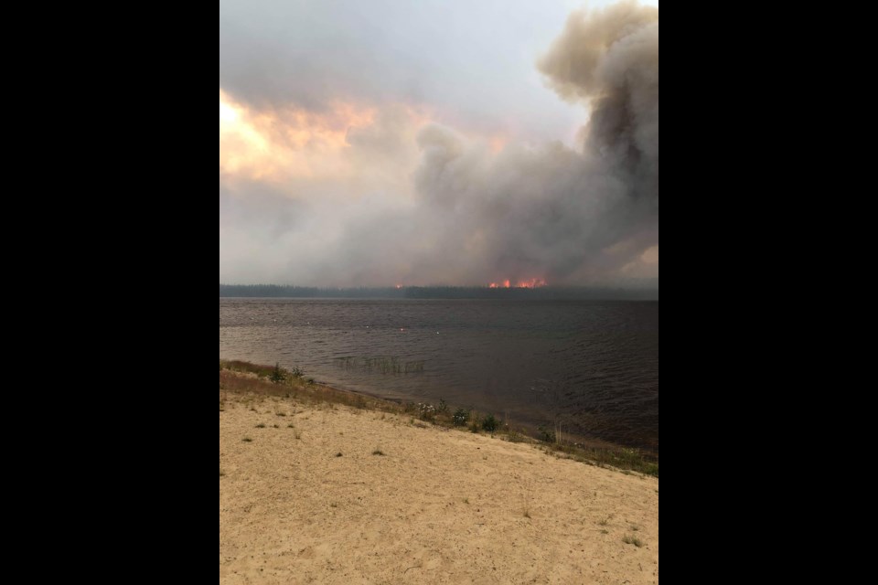Fires near Lynn Lake destroyed a camp building and prompted the evacuation of nearby Marcel Colomb First Nation July 24.